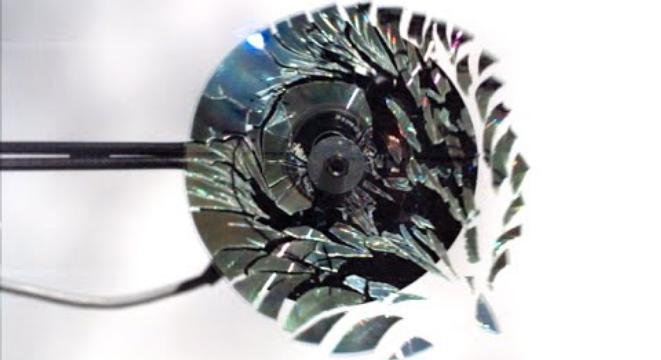 A CD Shattered By Rotational Speed, Filmed At 170,000fps